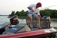 Large fishing baits hung on boat storage lid using Easy View Tackle System