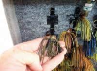 Fishing jigs organized and hanging on Easy View Tackle System in a boat